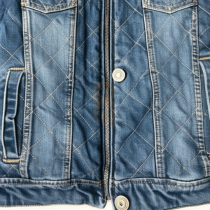 Women’s denim jacket with turtleneck collar, zip closure, quilted lining, and fine embroidered details for stylish streetwear.