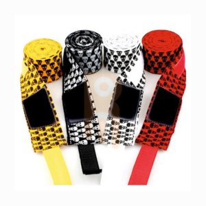 Four rolls of boxing hand wraps in yellow, black, white, and red with skull patterns.