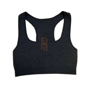 Black women's racerback sports bra with textured fabric and ribbed hem.