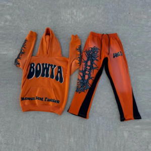 Men's orange heavyweight streetwear hoodie and sweatpants set with black vine graphics.